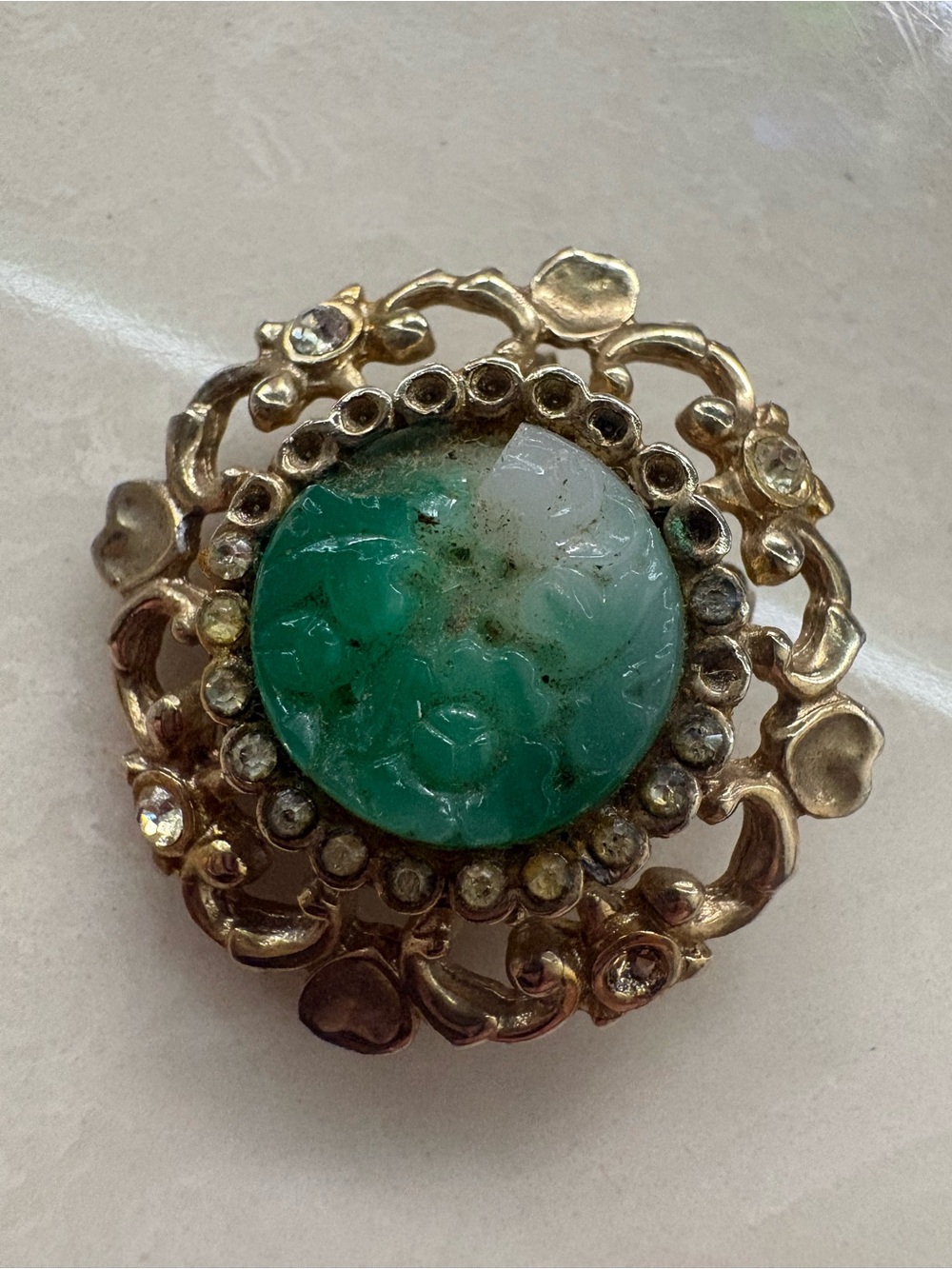 Gold-Tone Floral Brooch with Green and White Carved Center